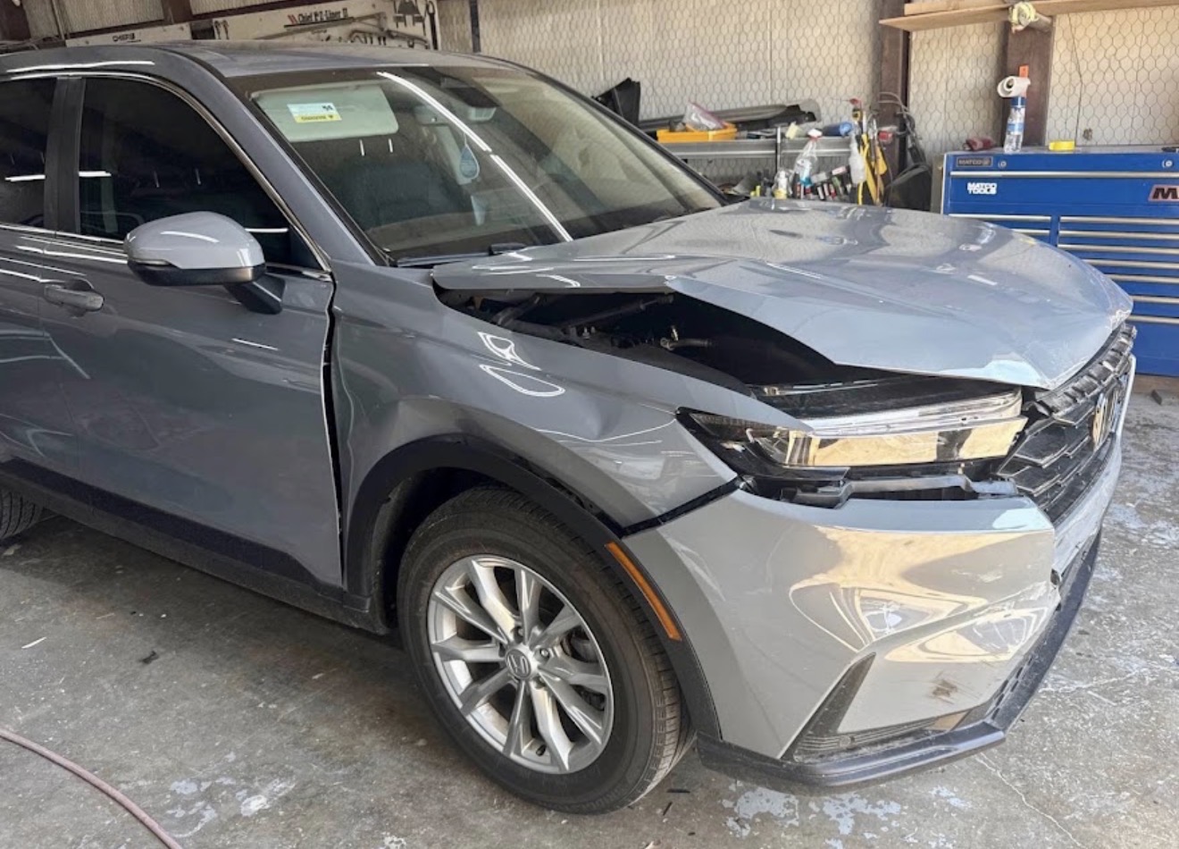 Honda CR-V with collision damage before repair at DG Collision Center Lewisville TX