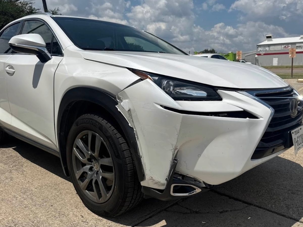 Lexus NX with front bumper and fender damage before repair at DG Collision Center Lewisville TX