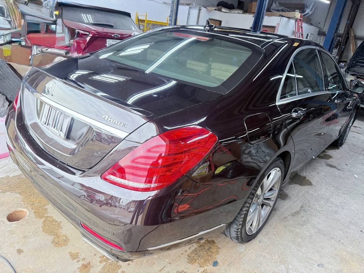 Rear-end collision repair for a Highland Village TX customer — trunk and bumper restored to factory finish at DG Collision Center