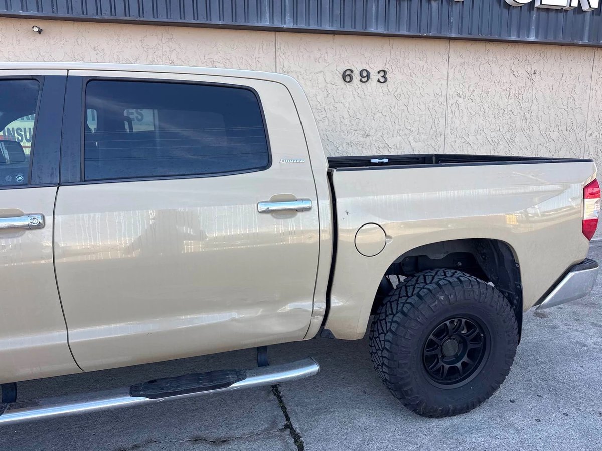Toyota Tundra with side-impact damage before repair at DG Collision Center Lewisville TX